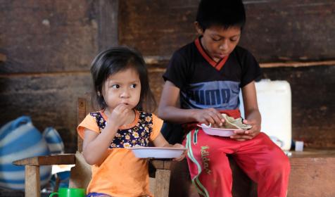 Aurelia's grandchildren eating the tortillas she made them for breakfast.