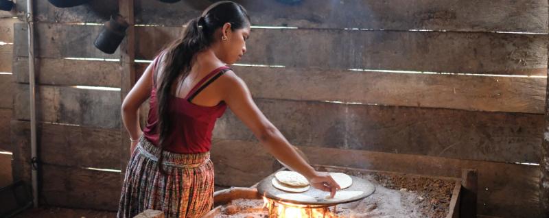 Amelia making breakfast tortillas.