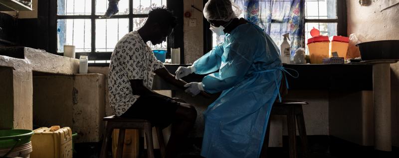 Doctor tends to patient