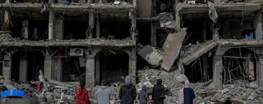 A family looks at an apartment block destroyed by a missile strike. Gaza City, 21 February 2024